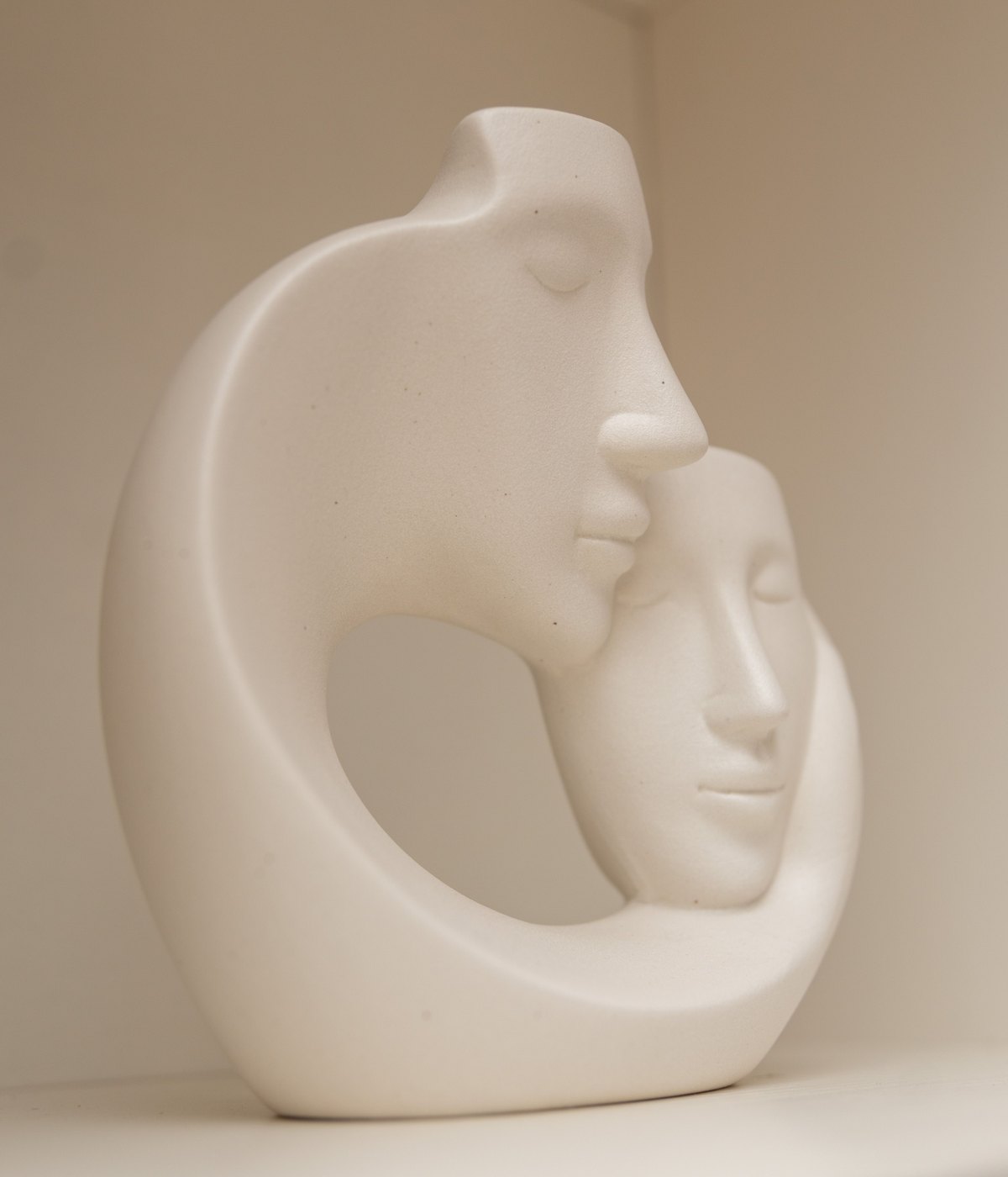 A large wood sculpture in the gallery space